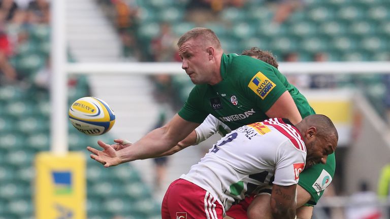 Kieran Low of London Irish tackled by Jordan Turner-Hall Harlequins