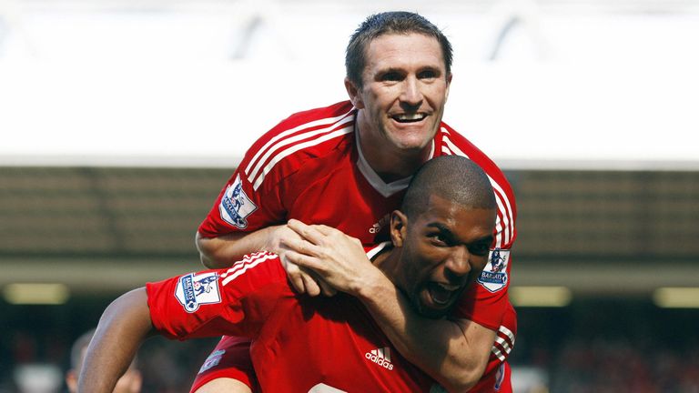 Ryan Babel celebrates with Robbie Keane after scoring Liverpool's winner in 2008