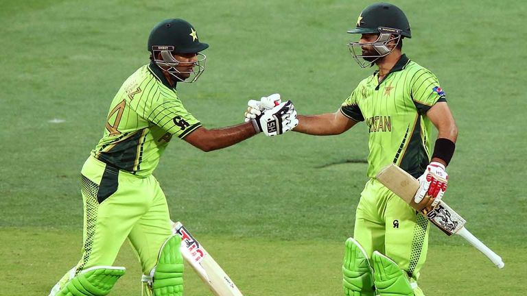 Sarfaraz Ahmed of Pakistan congratulates Ahmed Shahzad of Pakistan