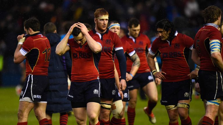 Scotland player Matt Scott reacts as team mates look on after the RBS Six Nations match between Scotland and Italy