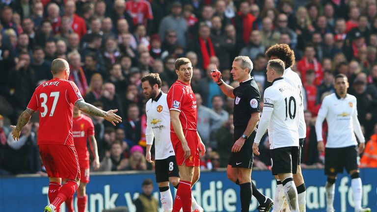 LIVERPOOL, ENGLAND - MARCH 22: Steven Gerrard of Liverpool is shown the red card by referee Martin Atkinson during the Barclays Premier League match betwee
