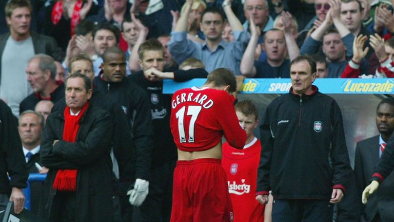 Manager Gerard Houllier (L) of Liverpool looks concerned as Steven Gerrard walks off the pitch after receiving a red card against Chelsea