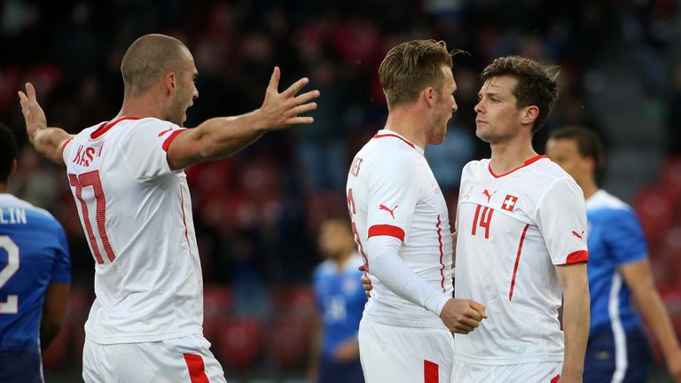  Valentin Stocker (R) of Switzerland celebrates the equalising goal with Pajtim Kasami (L) and Silvan Widmer