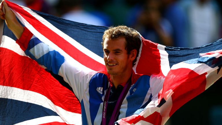 Andy Murray poses with his gold and silver medals after the medal ceremony for the Mixed Doubles Tennis at the London 2012 Olympic Games