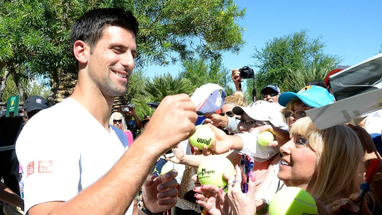 Novak Djokovic signs autographs at his mural unveiling during the BNP Parisbas Open at Indian Wells
