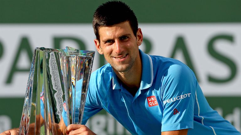 Novak Djokovic poses after defeating Roger Federer during the BNP Paribas Open at Indian Wells