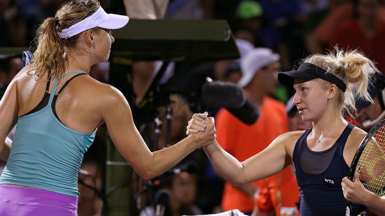 Dania Gavrilova shakes hands following a match against Maria Sharapova at the Miami Open