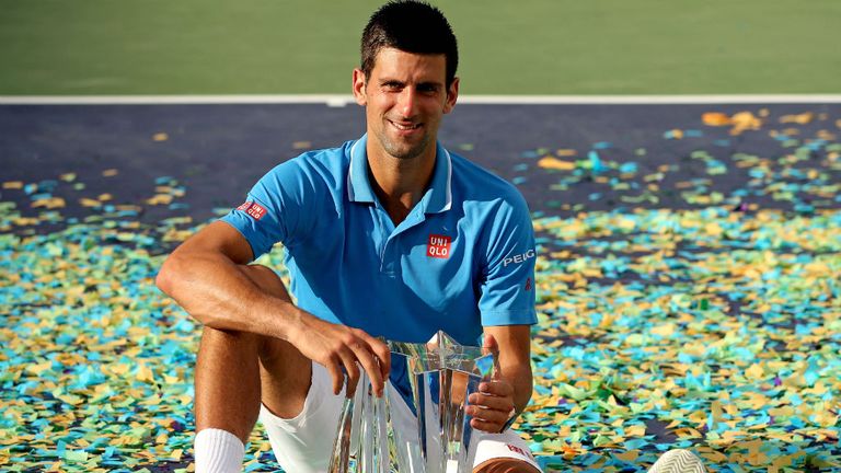 Novak Djokovic poses after defeating Roger Federer during the BNP Paribas Open final at Indian Wells