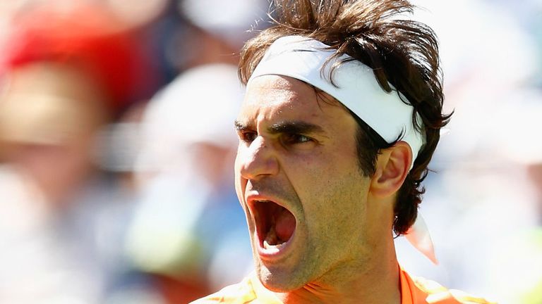 Roger Federer celebrates winning a point against Milos Raonic at Indian Wells