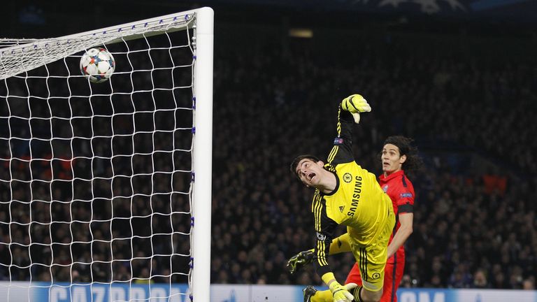 Chelsea's Thibaut Courtois (L) watches as the ball goes into his net