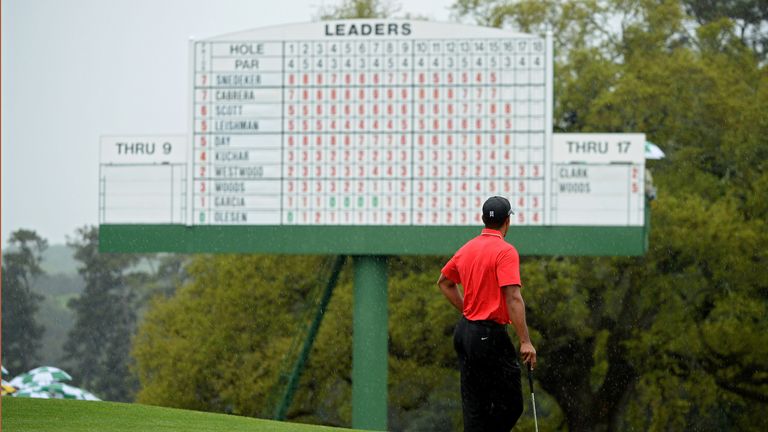 Tiger Woods of the United States stands on the 18th green during the final round of the 2013 Masters Tournament.