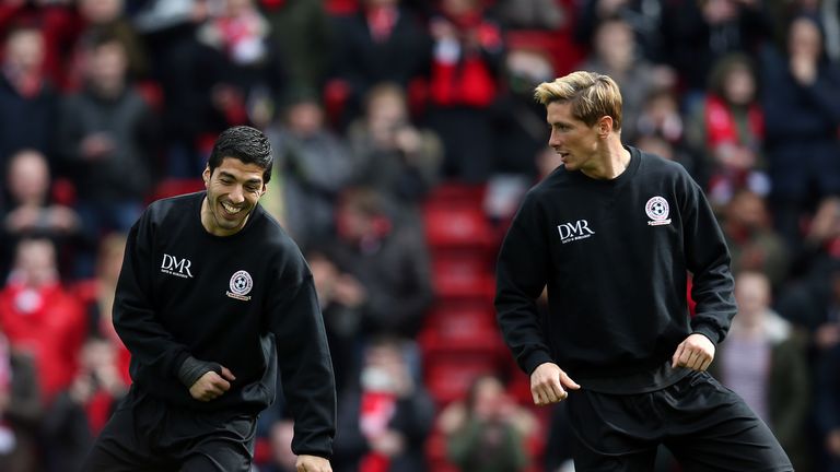 Luis Suarez and Fernando Torres of the Gerrard XI warm up ahead of the Liverpool All-Star Charity match at Anfield on March 