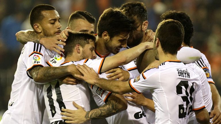Valencia's players celebrate their second goal