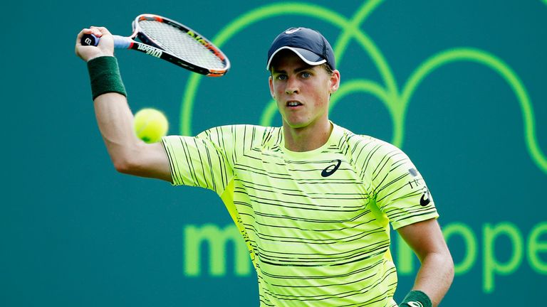 Vasek Pospisil of Canada returns the ball to Juan Martin Del Potro of Argentina during day 4 of the Miami Open