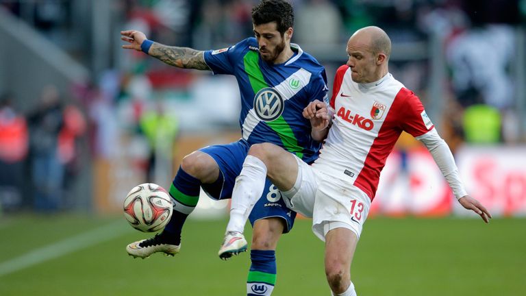 AUGSBURG, GERMANY - MARCH 07:  Vieirinha of VfL Wolfsburg and Tobias Werner of FC Augsburg battle for 