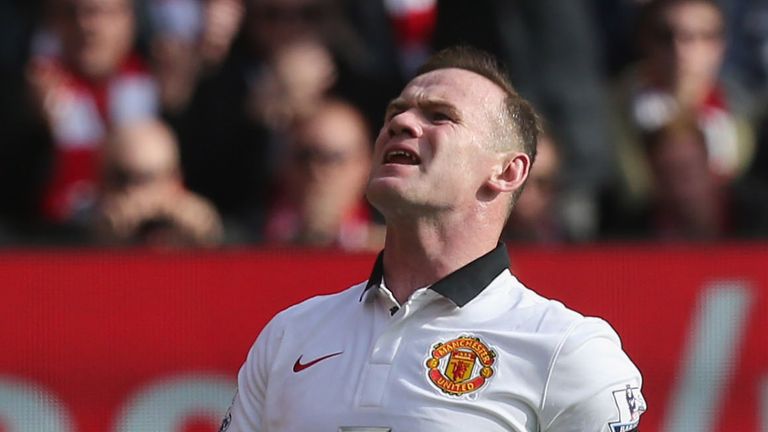 Wayne Rooney of Manchester United reacts to missing a penalty during the Barclays Premier League match between Liverpool and Manchester United at Anfield