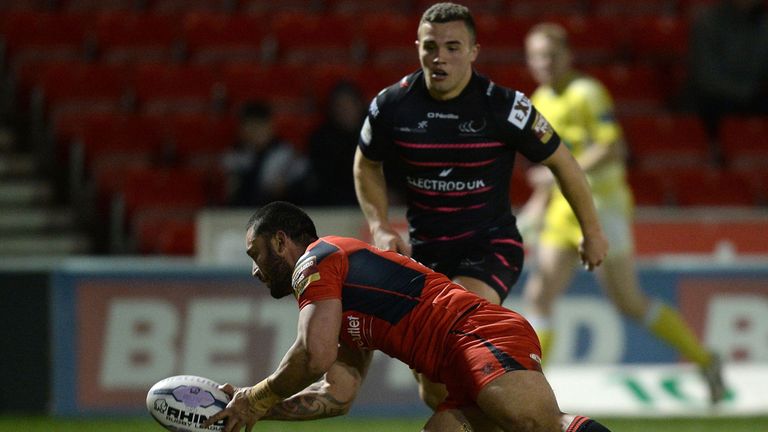 Salford Red Devils' Weller Hauraki goes over for a try against Widnes Vikings, during the First Utility Super League match at the AJ Bell Stadium, Eccles.