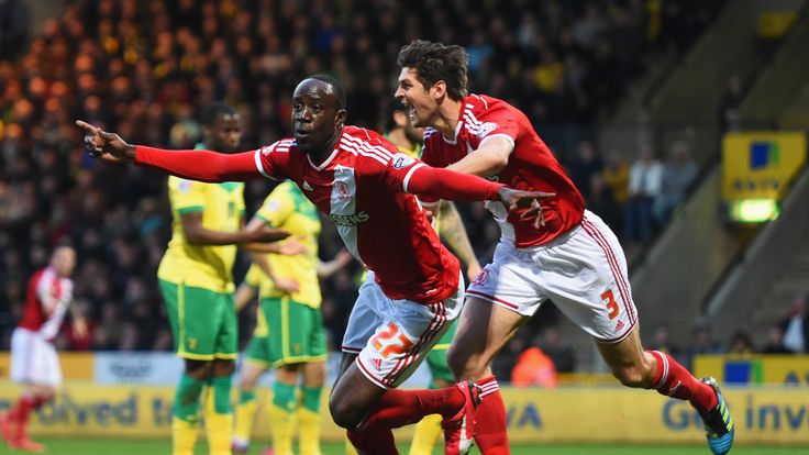NORWICH, ENGLAND - APRIL 17:  Albert Adomah (27) and George Friend of Middlesbrough (3) celebrate as Alexander Tettey of Norwich City scores their first go