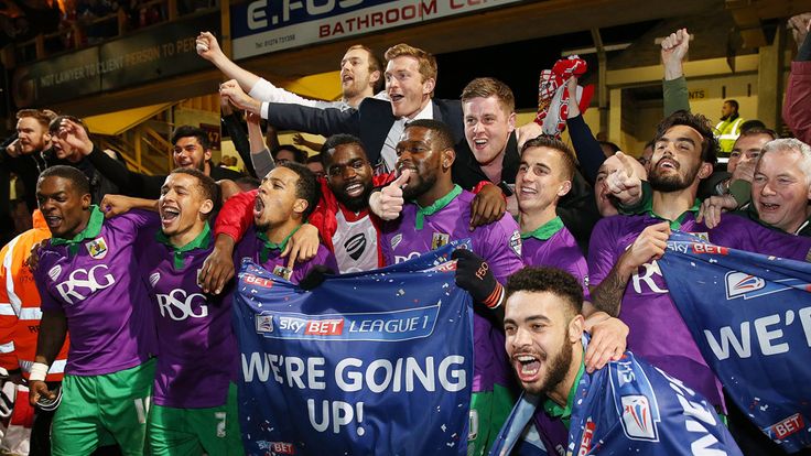 Bristol City's players celebrate promotion to the Championship at the end of the Sky Bet League One match at the Coral Windows Stadium, Bradford.