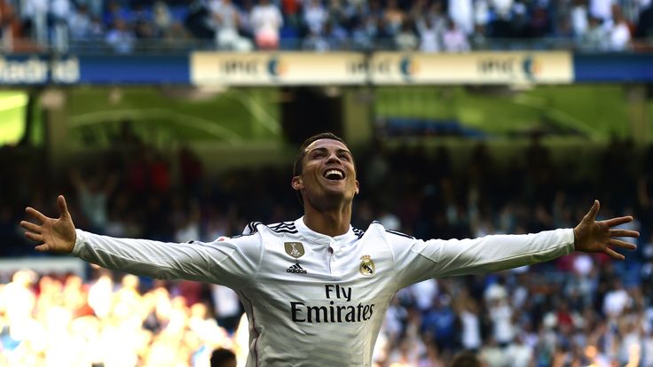 Cristiano Ronaldo celebrates a goal during the Spanish league football match Real Madrid v Granada at the Santiago Bernabeu
