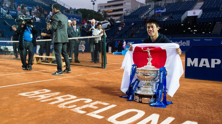  Kei Nishikori of Japan poses with the trophy of the Barcelona Open Banc Sabadell after defeating Pablo Andujar of Spain 
