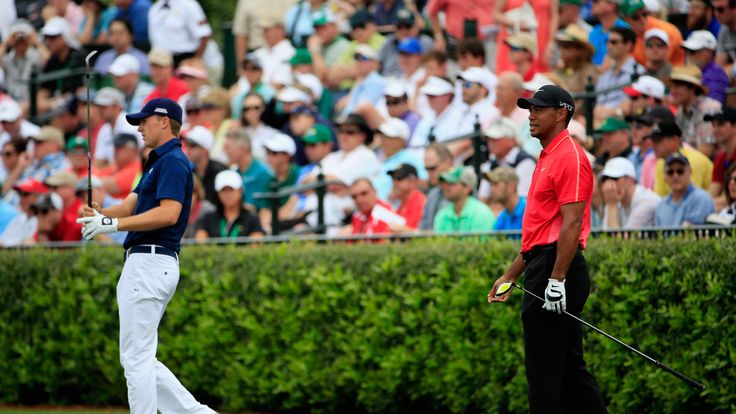 Jordan Spieth and Tiger Woods of the United States work on the practice ground during the final round at Augusta on April 12, 2015