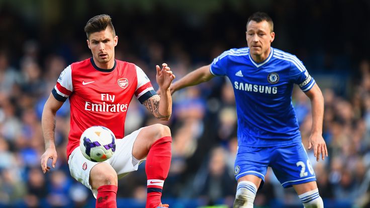 Olivier Giroud of Arsenal and John Terry of Chelsea battle for the ball during the Barclays Premier League match in March 2014