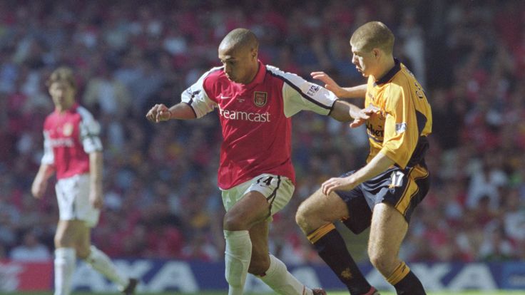 Thierry Henry of Arsenal holds off Steven Gerrard of Liverpool during the FA Cup Final at the Millennium Stadium in 2001