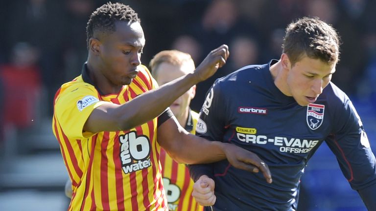 Partick Thistle's Abdul Osman battles for the ball with Filip Kiss (right) 