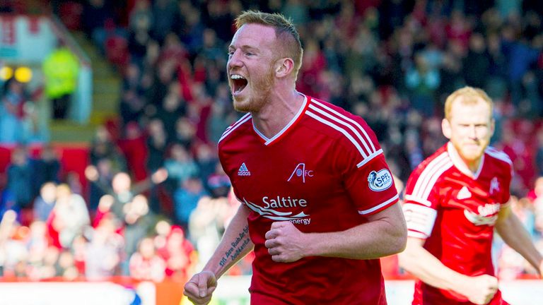 Adam Rooney celebrates after putting Aberdeen  1-0 up.