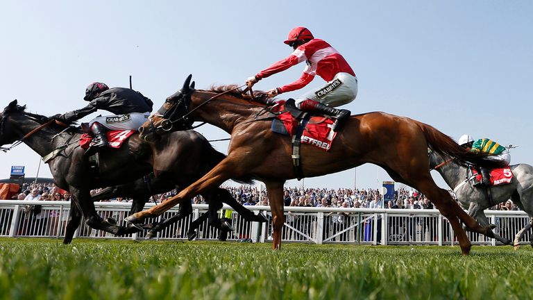 All Yours (nearside) begins the run that takes him to victory at Aintree