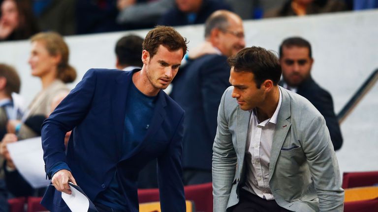 Tennis players Andy Murray and Ross Hutchins arrive at the UEFA Champions League match between Barcelona and PSG