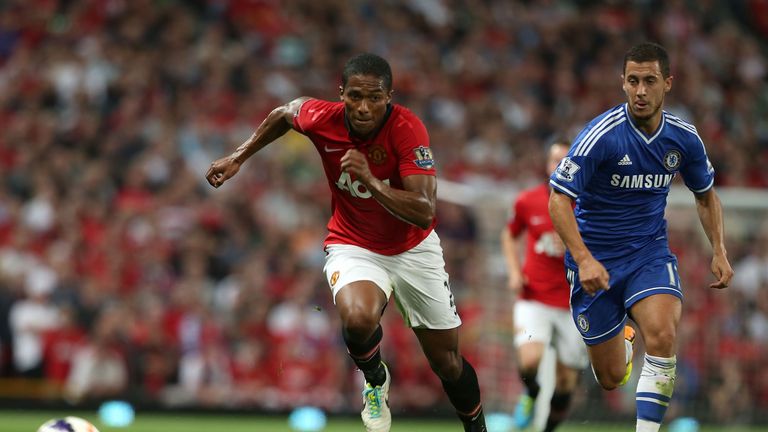 Antonio Valencia of Manchester United and Eden Hazard of Chelsea at Old Trafford on August 26, 2013 in Manchester, England.