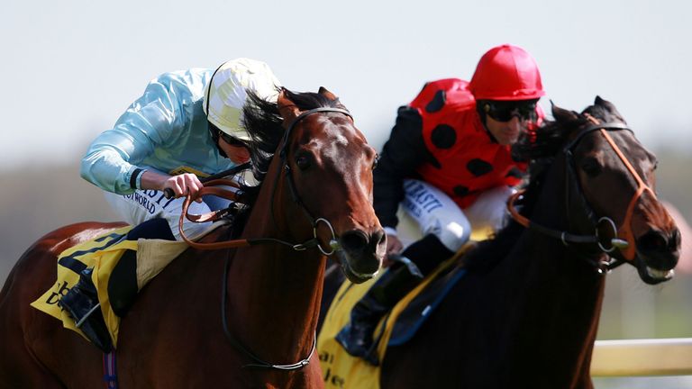 Arab Spring ridden by Ryan Moore (left) wins the Dubai Duty Free Finest Surprise Stakes from Pether's Moon