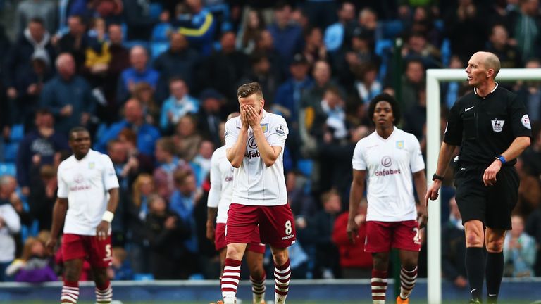 MANCHESTER, ENGLAND - APRIL 25:  Tom Cleverley of Aston Villa reacts after the goal scored by Fernandinho of Manchester City during the Barclays Premier Le