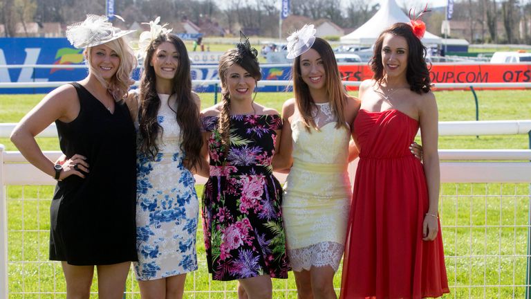 Racegoers pose before the 2015 Coral Scottish Grand National Festival at Ayr Racecourse.