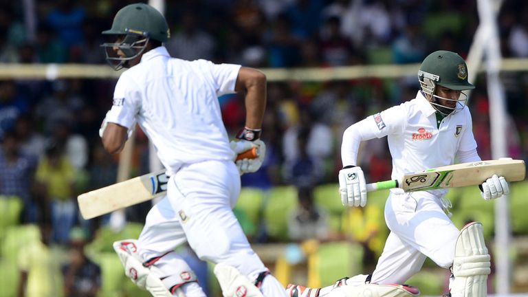 Bangladesh cricketers Mohammad Mahmudullah (R) and Mominul Haque run between the wickets