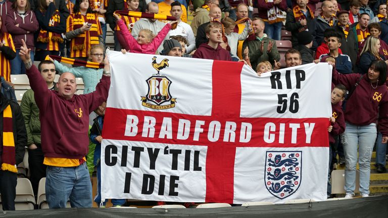Bradford City fans celebrate their sides victory at the end of the game with Barnsley