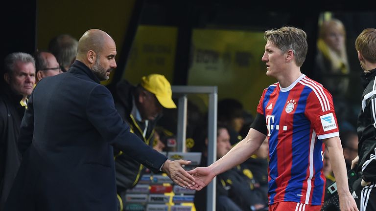 Pep Guardiola shake hands with Bastian Schweinsteiger of Bayern Munich after his substitution during the Bundesliga match against Borussia Dortmund