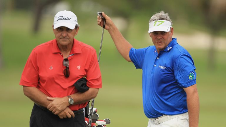 MIAMI, FL - MARCH 07:  Darren Clarke of Northern Ireland pulls a club alongside Bob Rotella during the final practice round prior to the start of the World