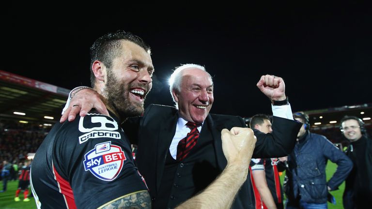Elliott Ward of Bournemouth and Bournemouth chairman Jeff Mostyn celebrate victory on the pitch after the Sky Bet Championship
