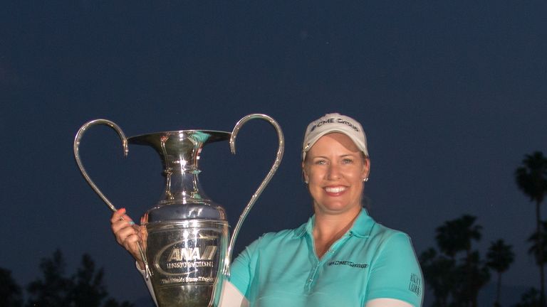 Brittany Lincicome poses with the champions trophy after winning the ANA Inspiration title