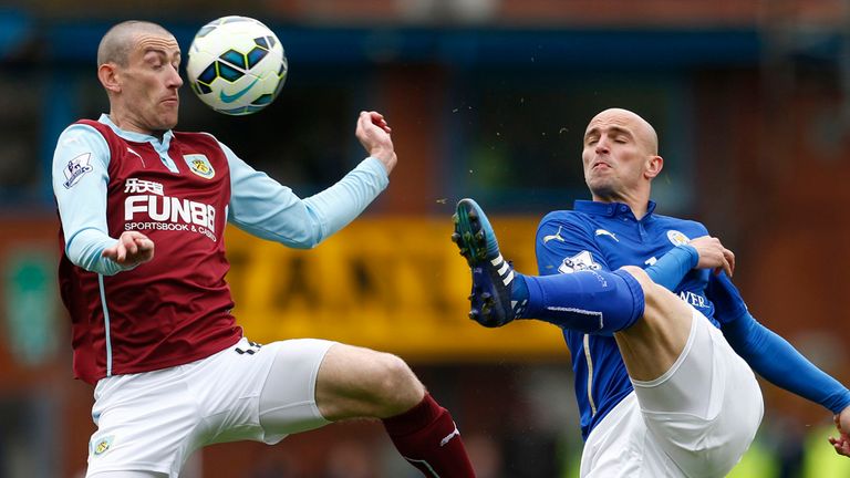 Burnley's David Jones (left) and Leicester City's Esteban Cambiasso battle for the ball during the Barclays Premier League match at Turf Moor, Burnley.