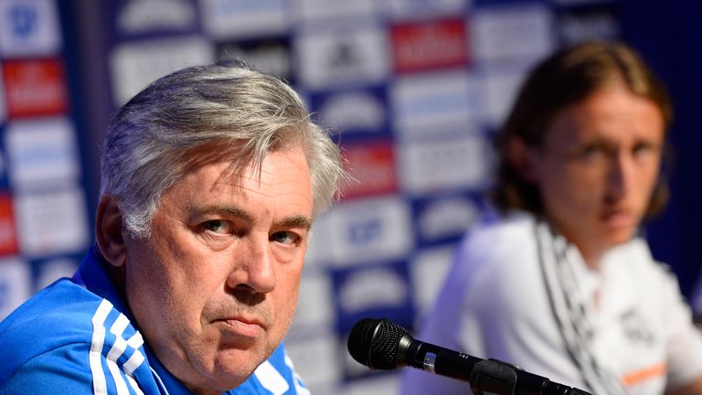 Real Madrid's Italian coach Carlo Ancelotti (L) and Croatian midfielder Luka Modric are pictured during a press conference on the day of the friendly footb