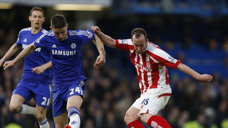 Stoke City's Scottish midfielder Charlie Adam vies with Gary Cahill during the Premier League football match between Chelsea and Stoke n