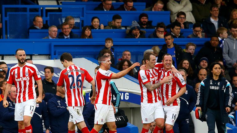 Charlie Adam of Stoke City celebrates with team-mates after scoring his team's first goal during the Barclays Premier League m