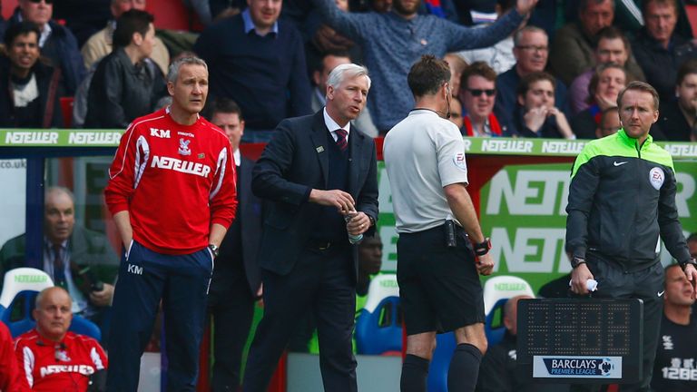 Manager Alan Pardew of Crystal Palace speaks to Referee Mark Clattenburg during the Barclays Premier League match between Crystal Palace and Hull City 