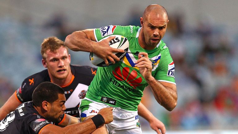 CANBERRA, AUSTRALIA - AUGUST 30:  Dane Tilse of the Raiders is tackled by Adam Blair of the Tigers during the round 25 NRL match between the Canberra Raide