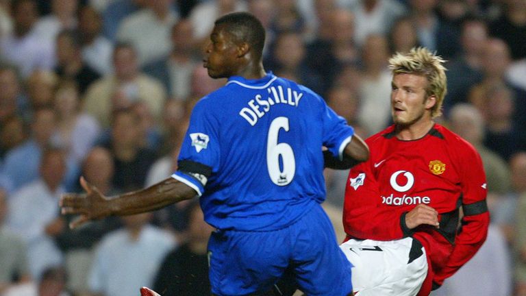 LONDON, UNITED KINGDOM:  Manchester United's David Beckham (R) shoots past defender Marcel Desailly  of Chelsea to score during their premier league match 