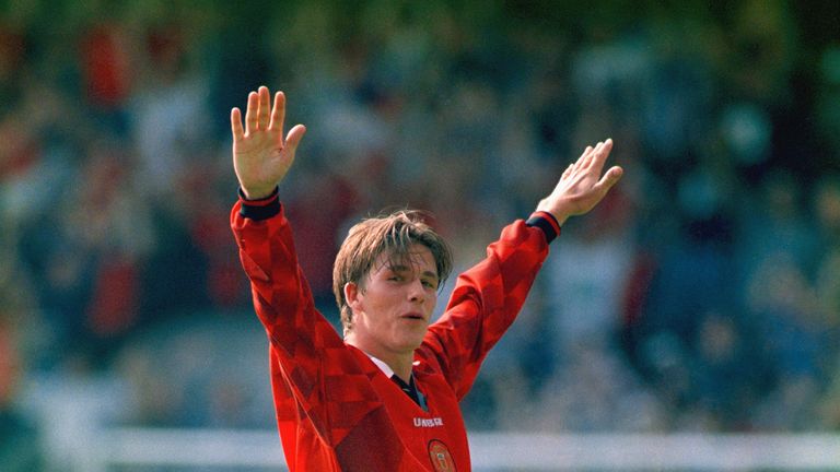 David Beckham celebrates after scoring from the halfway line, during the Premier League match between Wimbledon and Man Utd at Selhurst Park in 1996
